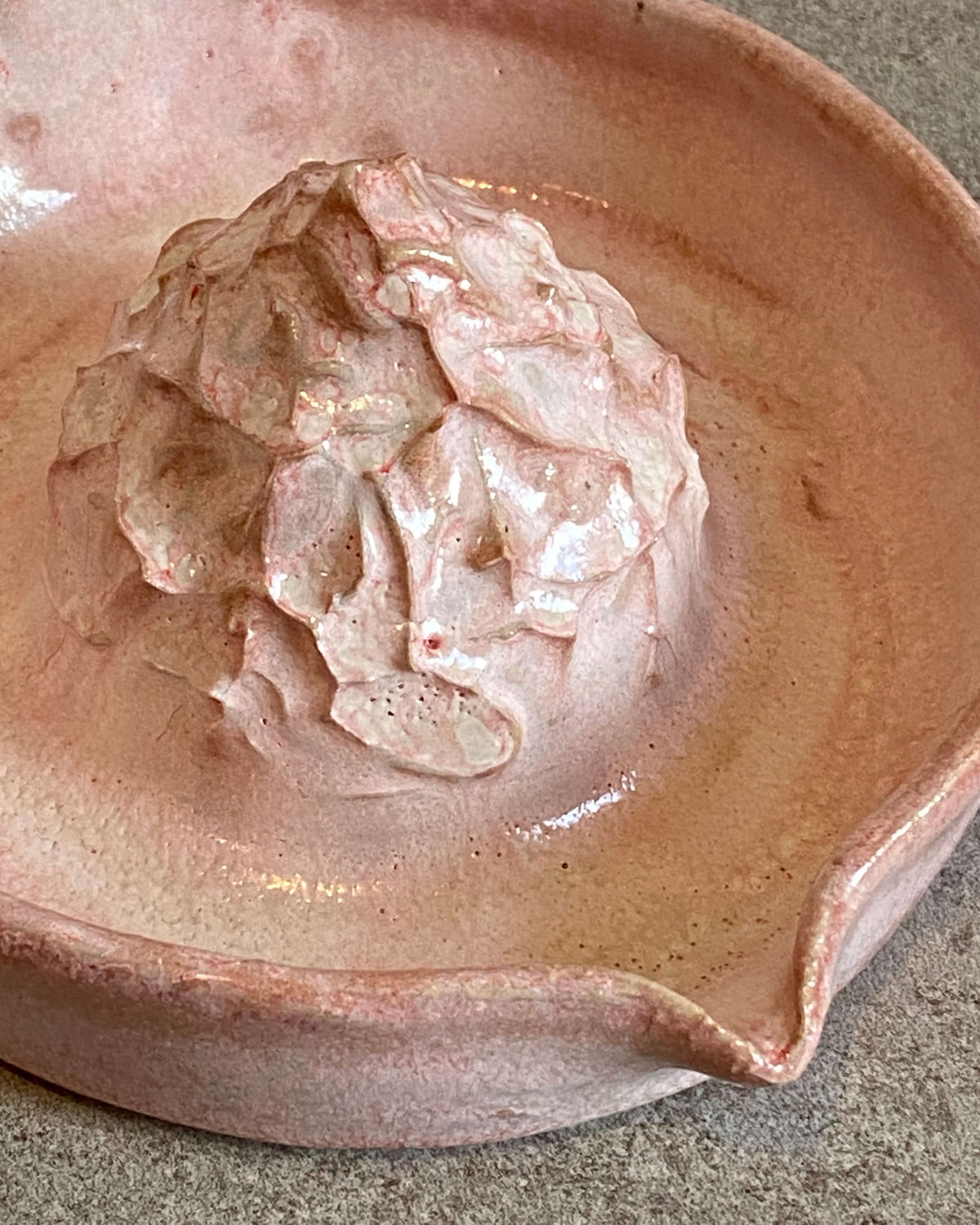 Nærbillede af presseknoppen på citruspresser Rosa